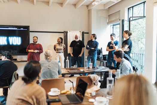 A diverse team gathers for an interactive presentation, promoting teamwork and collaboration.