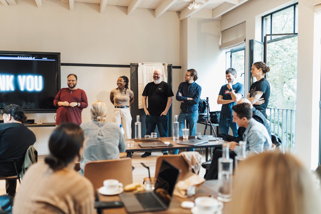 Free Smiling People in Meeting Room in Office Stock Photo