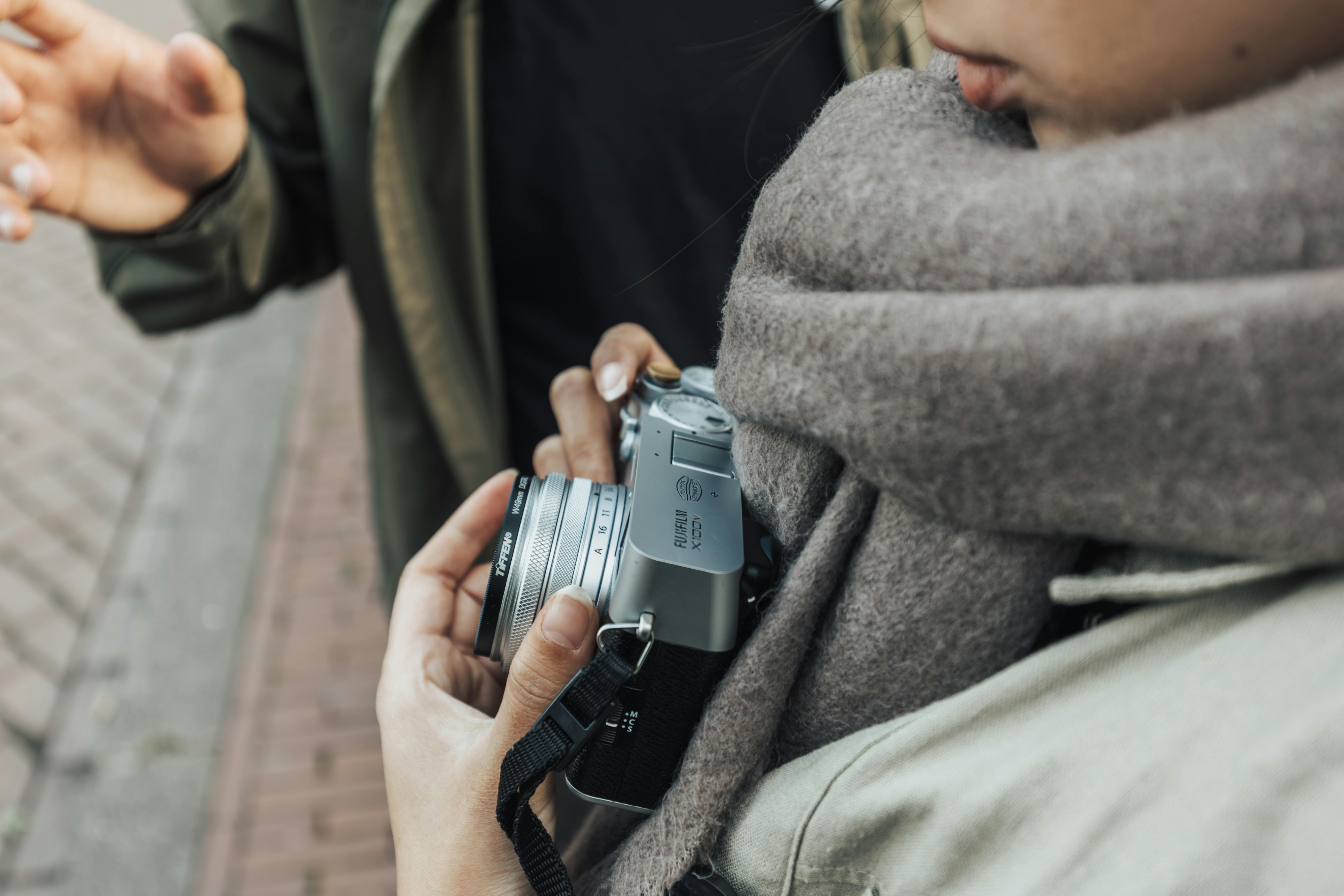 woman hands holding camera