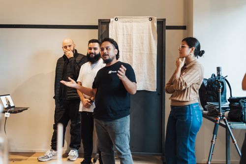 Free Group discussing and presenting ideas during a meeting in a modern office environment. Stock Photo