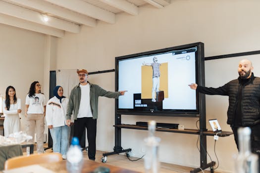 Diverse team delivering a digital presentation in a modern office environment.