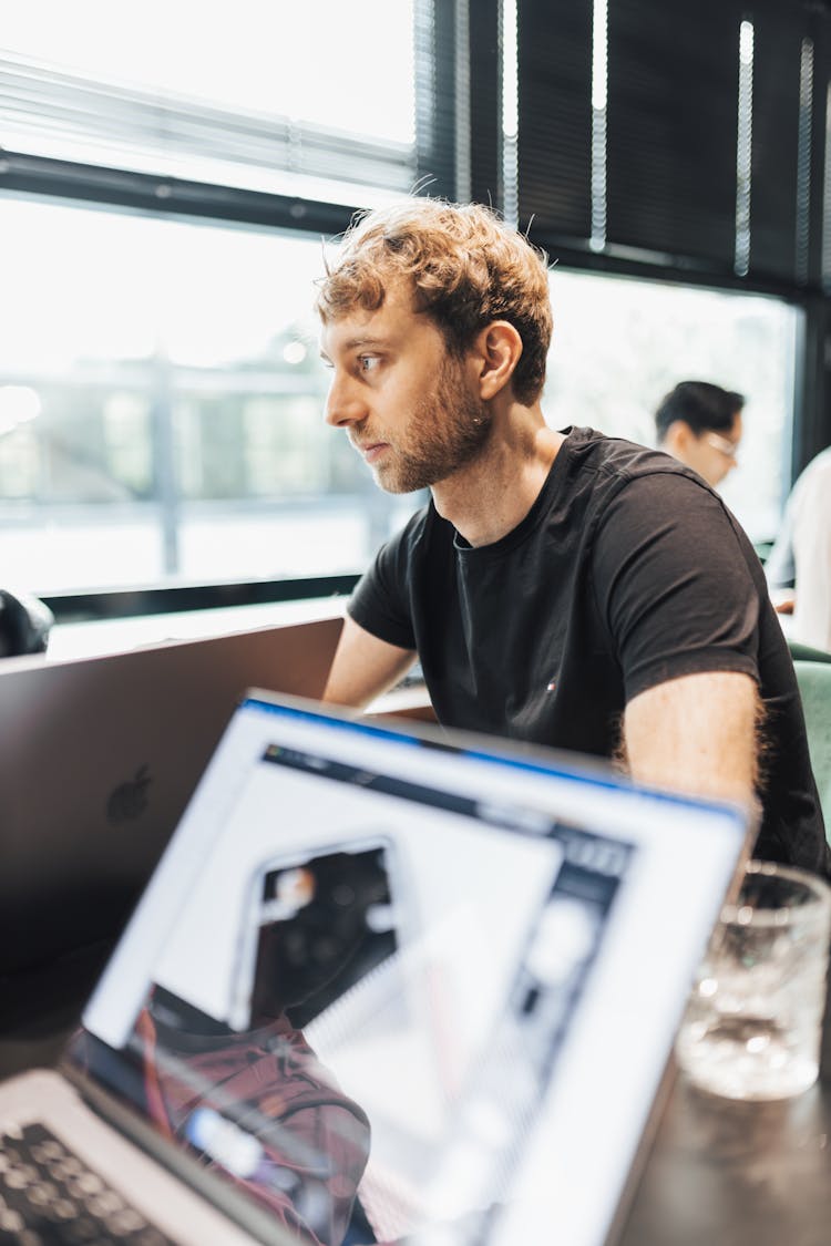 Man Sitting In A Company Meeting