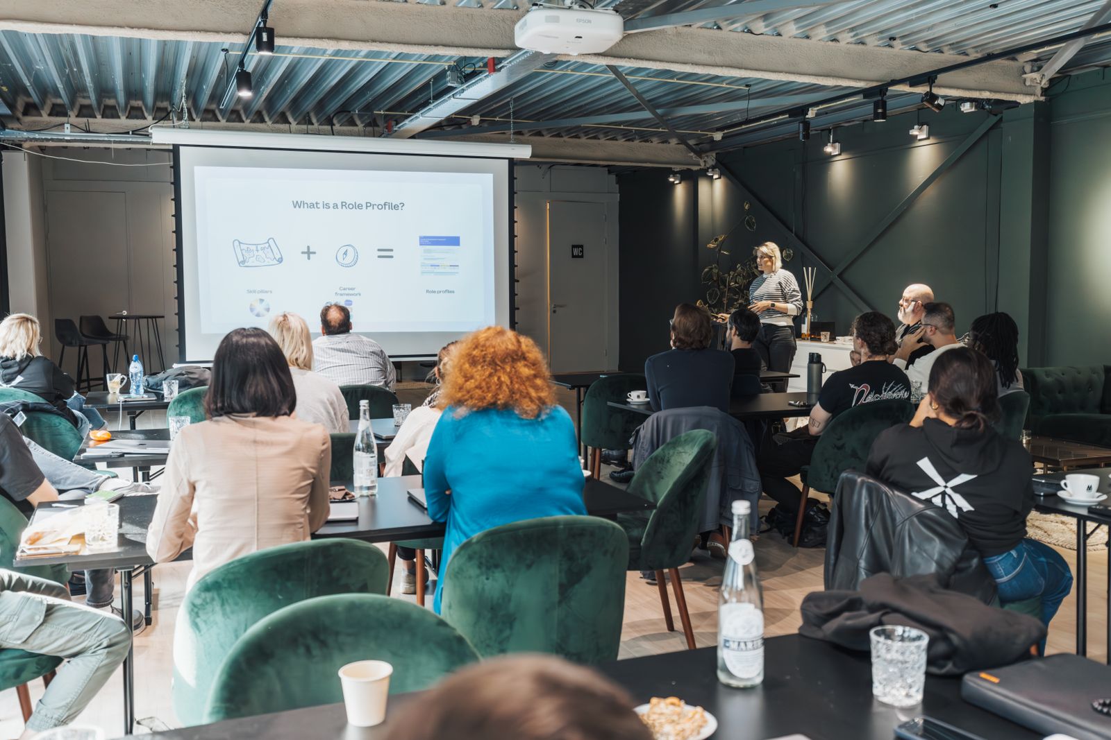 Professionals attending a leadership presentation