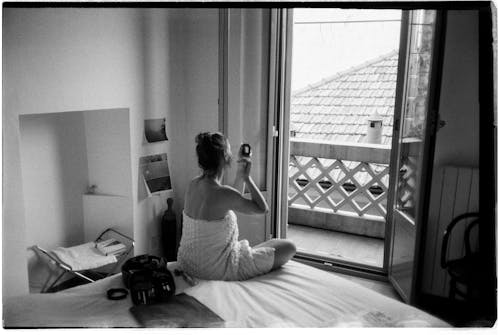 Woman Doing Morning Routine on Bed