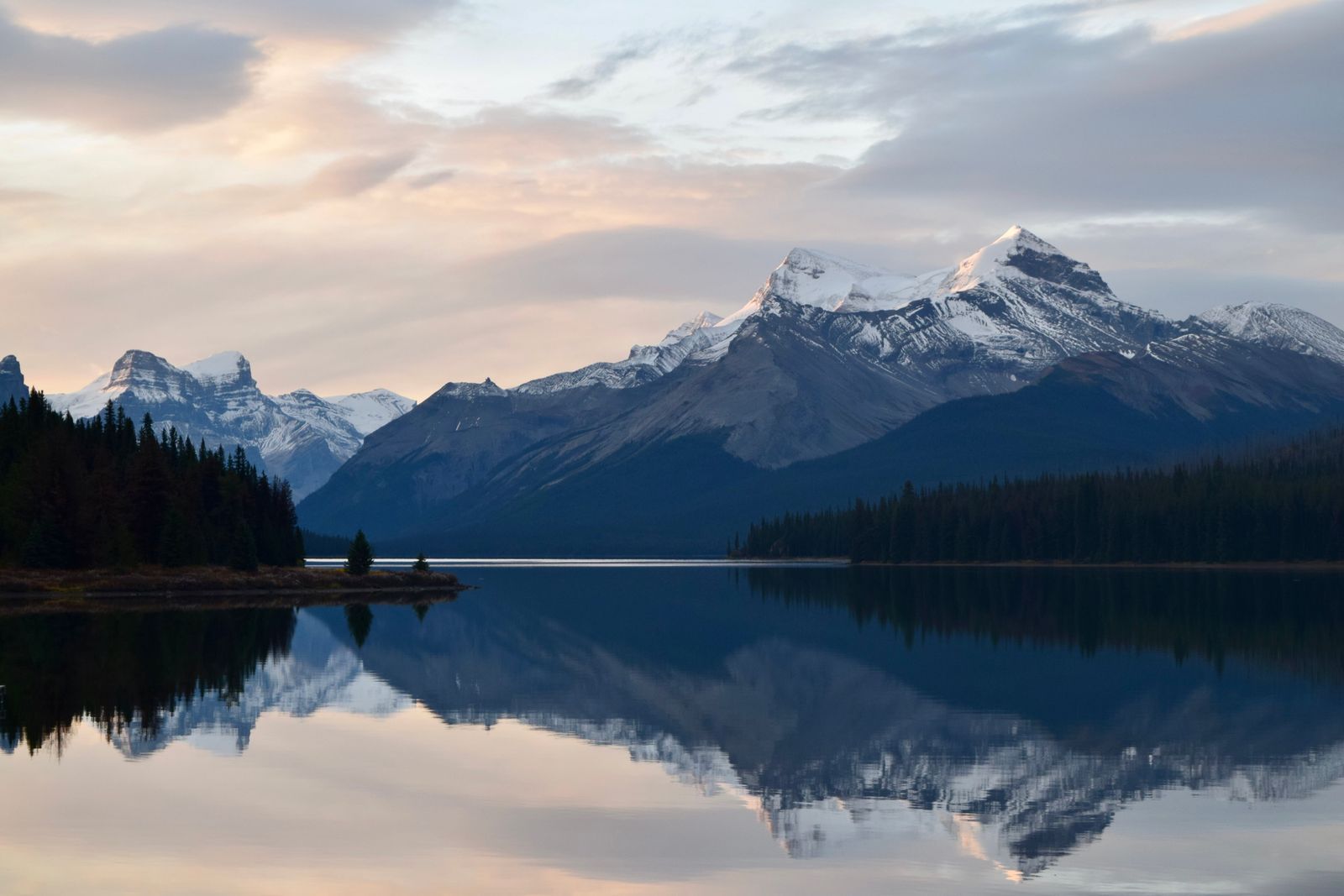 Maligne Lake reflecting surrounding mountains in Jasper National Park