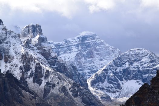 Breathtaking view of snow-capped peaks at Lake Louise, Alberta, Canada.