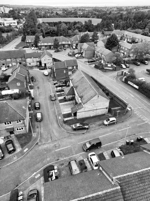 Free Black and white aerial shot of Leagrave, England showcasing streets and houses. Stock Photo
