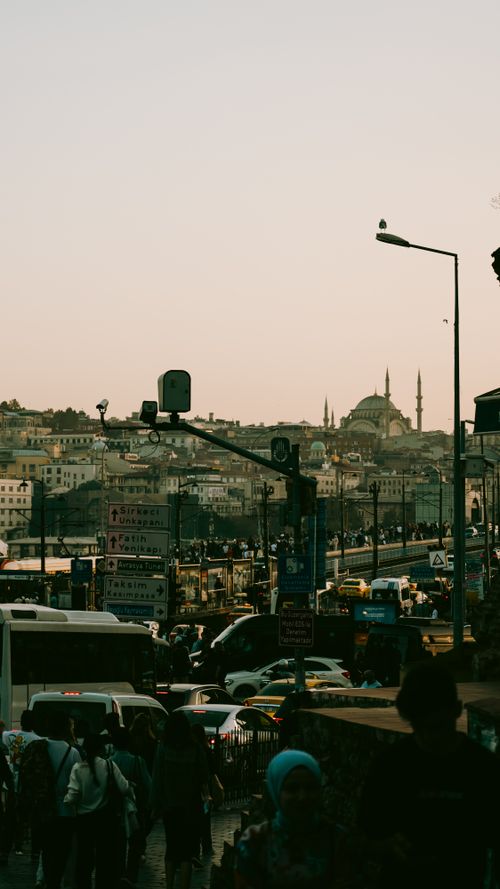 Free Traffic and city life in Istanbul with a mosque silhouette at dusk. Stock Photo