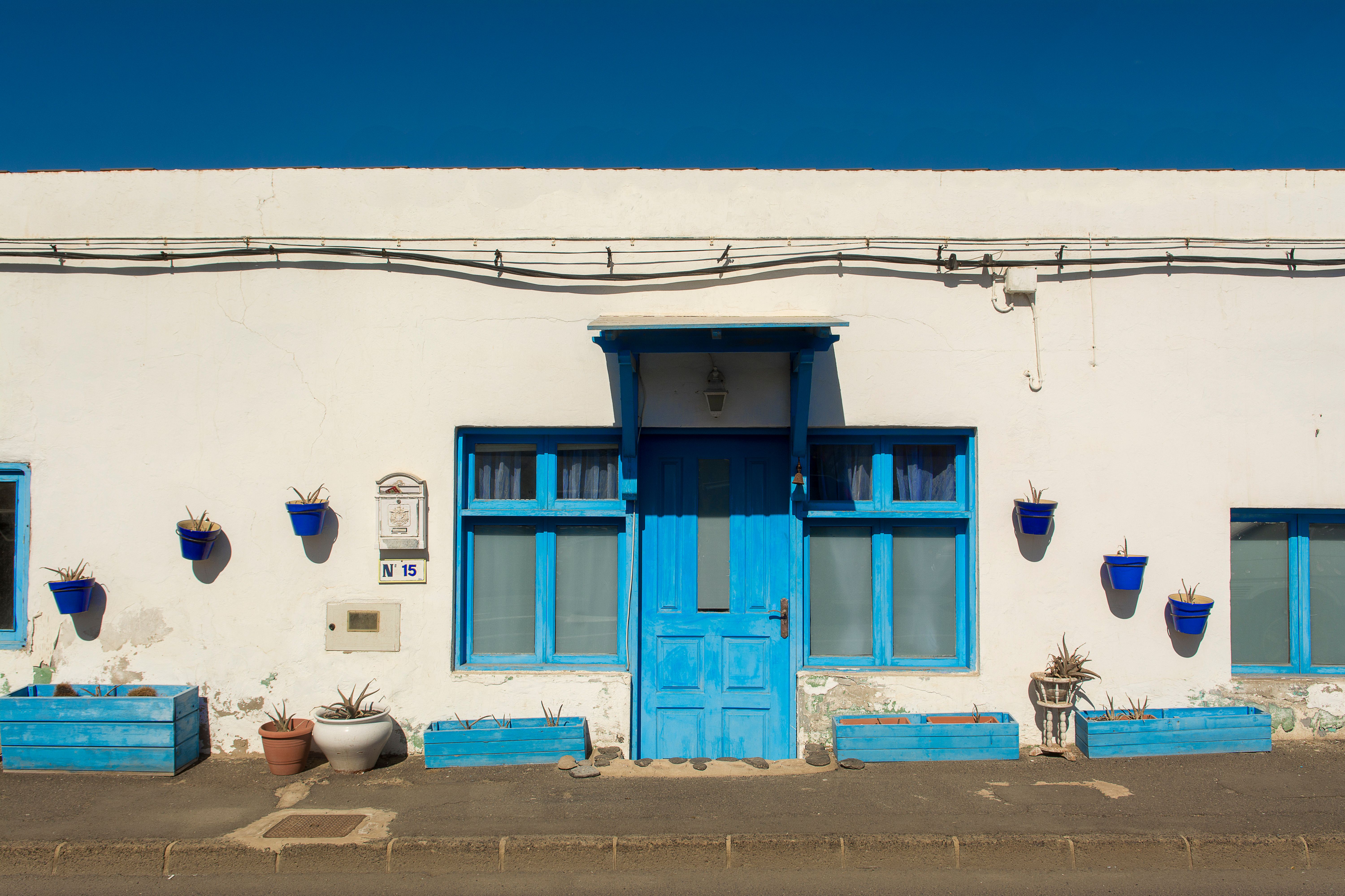 Single Story Building with Blue Doors and Windows · Free Stock Photo