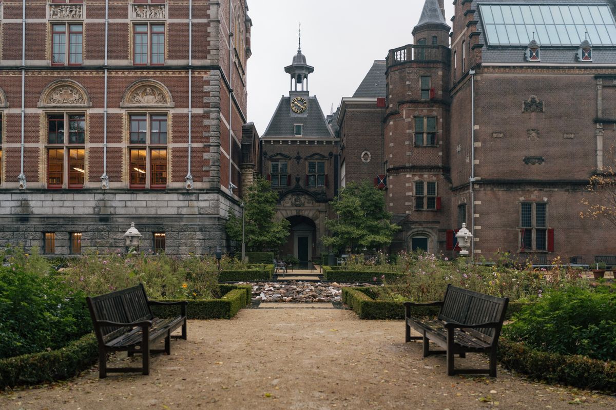 Visitors relaxing in the gardens outside the Rijksmuseum in Amsterdam