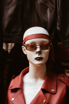 Fashionable mannequin in a red leather jacket with sunglasses in Denizli, Türkiye.