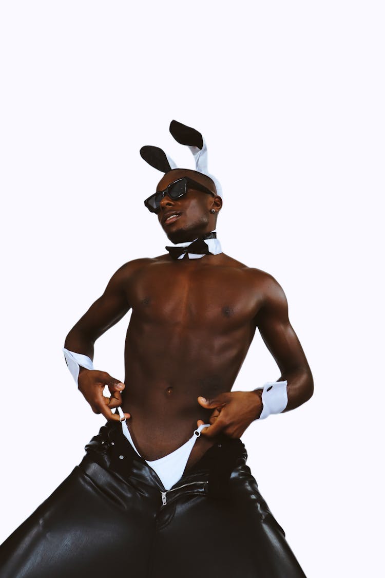 Man In Leather Pants Wearing Bunny Ears Pulling Up His Underwear