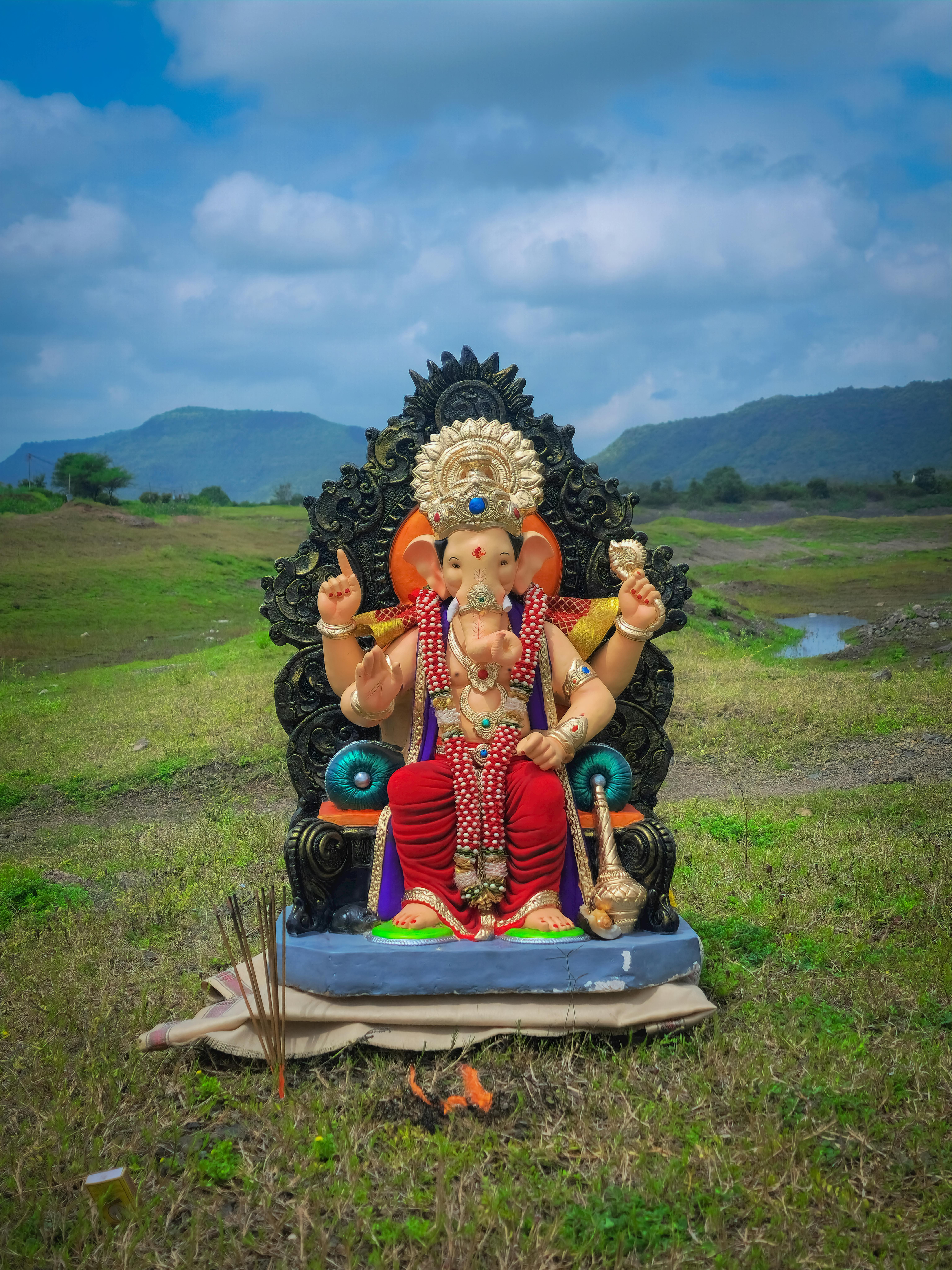 Detailed Ganesha statue outdoors in Satara, highlighting Hindu culture and tradition.