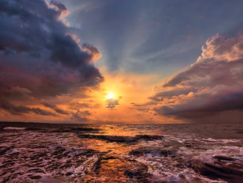 Sunset Among Clouds over Sea