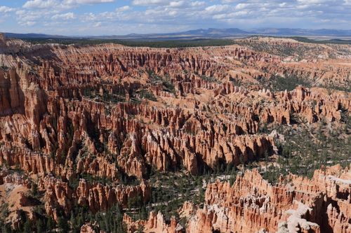 Free Stunning aerial shot of Bryce Canyon's unique rock formations under a bright day sky. Stock Photo
