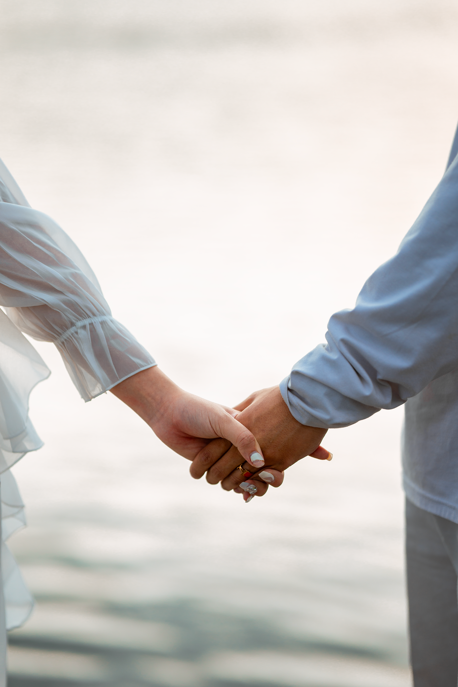 Romantic Couple Holding Hands Outdoors · Free Stock Photo