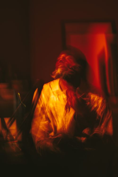 Free A blurred artistic portrait with vibrant, warm lighting, creating a dreamy atmosphere. Stock Photo