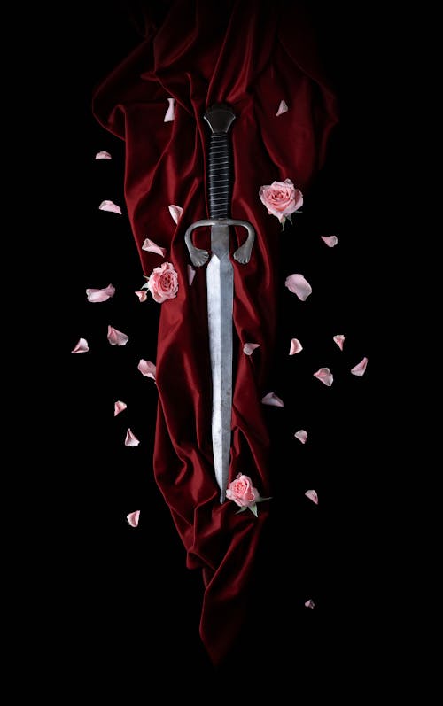 Roses Petals around Dagger