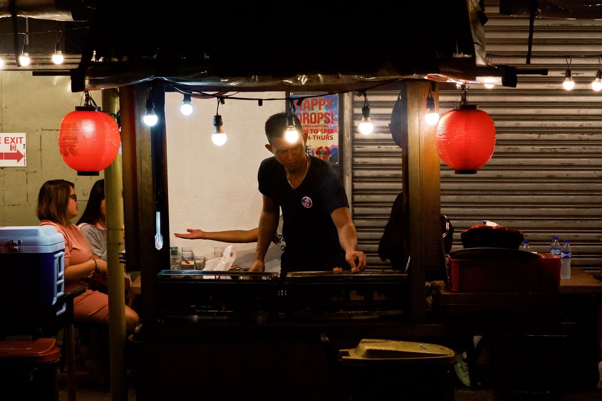 Asian chef cooking in a professional kitchen