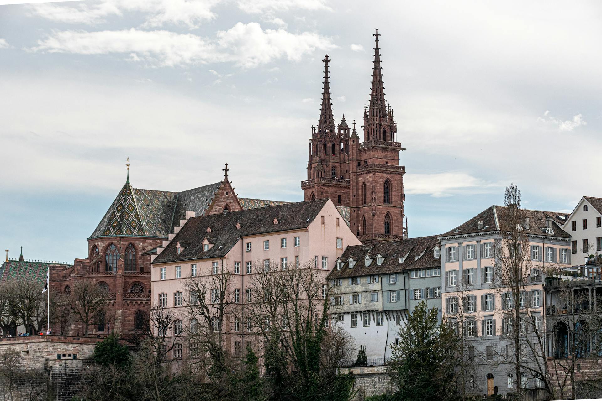 Beautiful Gothic architecture of Basel Minster with cityscape in Basel, Switzerland.