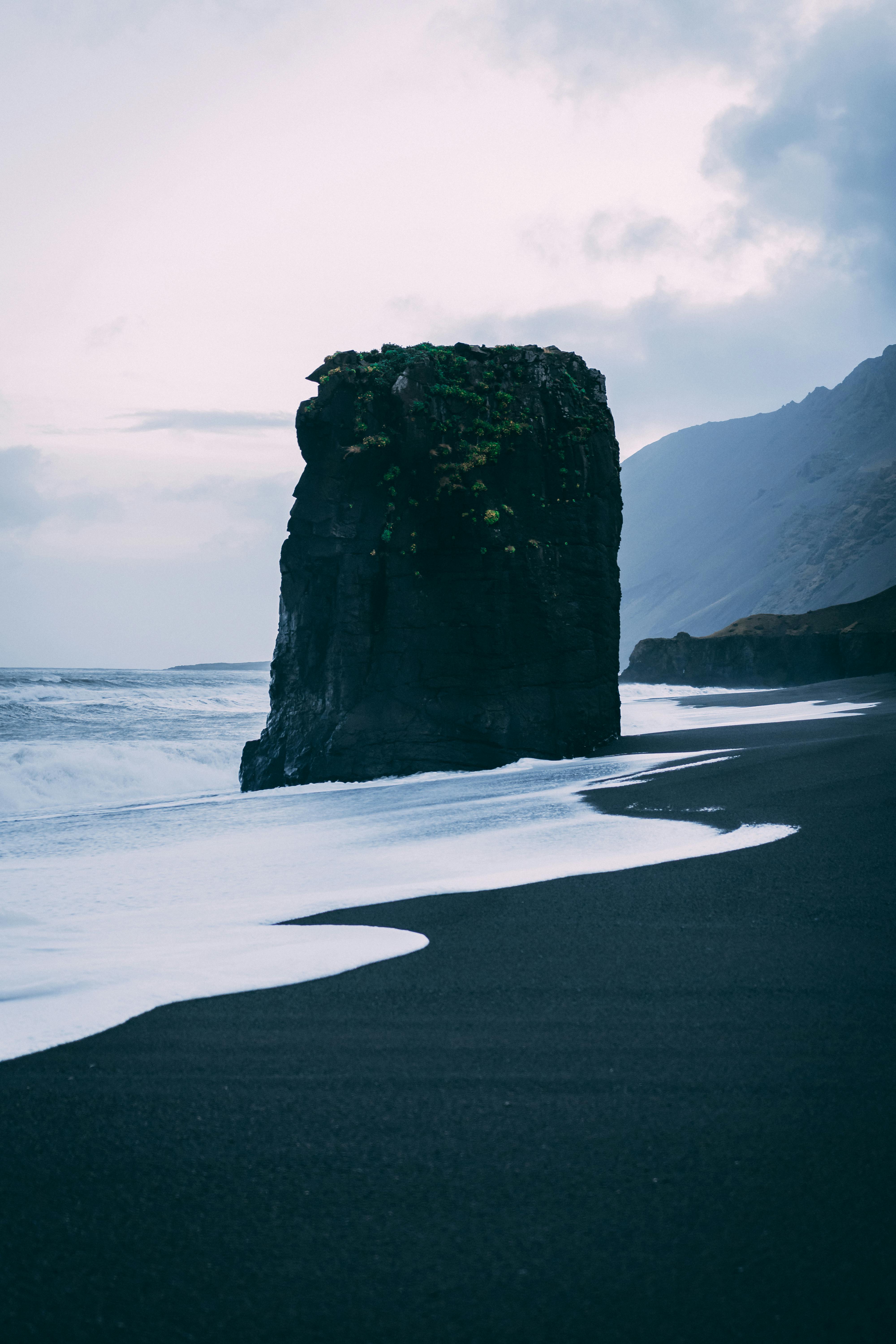 Black Rock Formation Near Sea · Free Stock Photo
