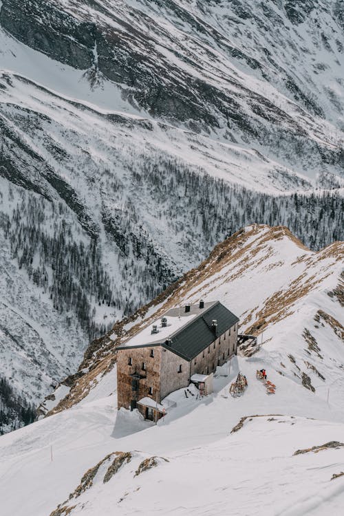 Building in a Mountain Valley Covered with Snow 