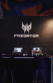 Gaming area featuring dual Predator laptops on a desk, ideal for gaming conventions.