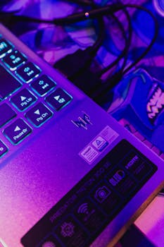 Detailed shot of Acer Predator Triton 300 SE laptop with glowing keyboard, highlighting LED lighting and gaming features.