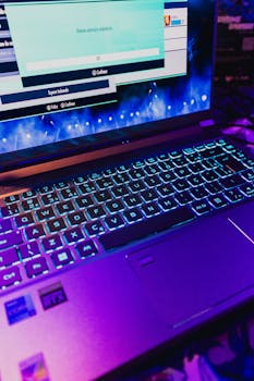 Colorful gaming laptop with illuminated keyboard displaying a game screen, perfect for technology and gaming enthusiasts.