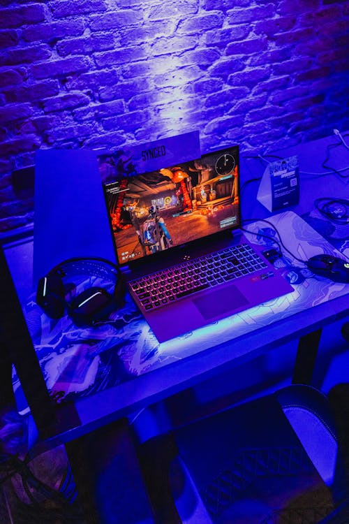 Modern Gaming Laptop and Headphones on a Desk 