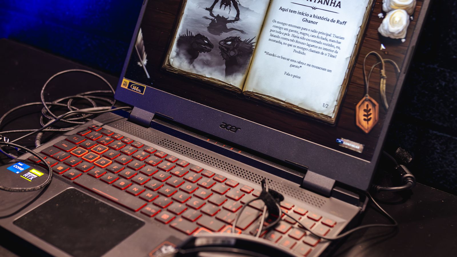 A gaming laptop and headphones with a fantasy game interface on the screen, a real stock photo with no people in the frame, chosen because Aion 2 is a fantasy MMORPG played mostly on PC. It is not a screenshot of Aion 2