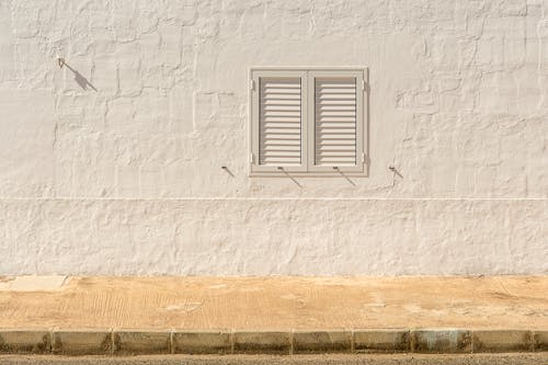 White, Sunlit House Wall