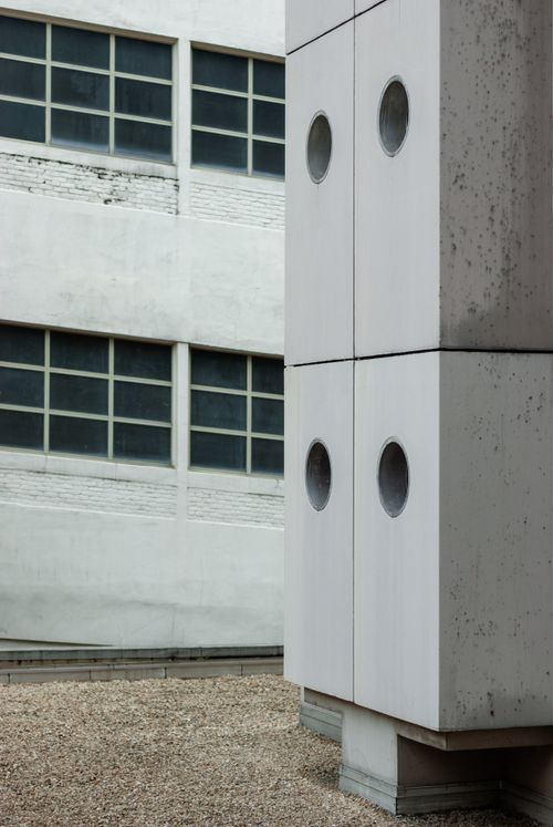 Free Contemporary building facade with circular windows in Paris. Stock Photo