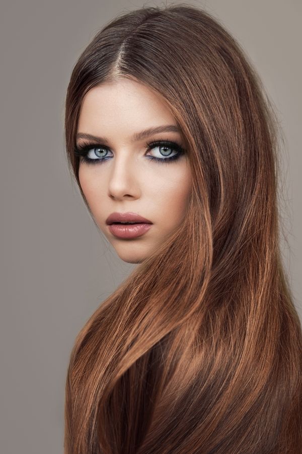 Sleek straight long hair with middle part