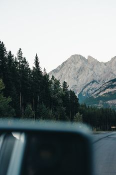 Explore the breathtaking mountain views and lush forests of Kananaskis, Alberta during a serene road trip.