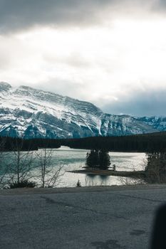 Scenic view of snowy mountains and lake in Banff National Park, Alberta, Canada.