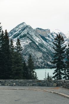 Panoramic view of snow-capped mountains and forest in Banff National Park during winter.