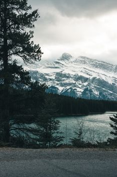 Snow-covered mountains and lake in Banff National Park, Canada during winter.