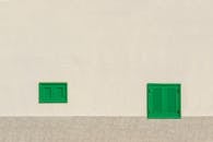 Facade of a Building with Green Window Shutters