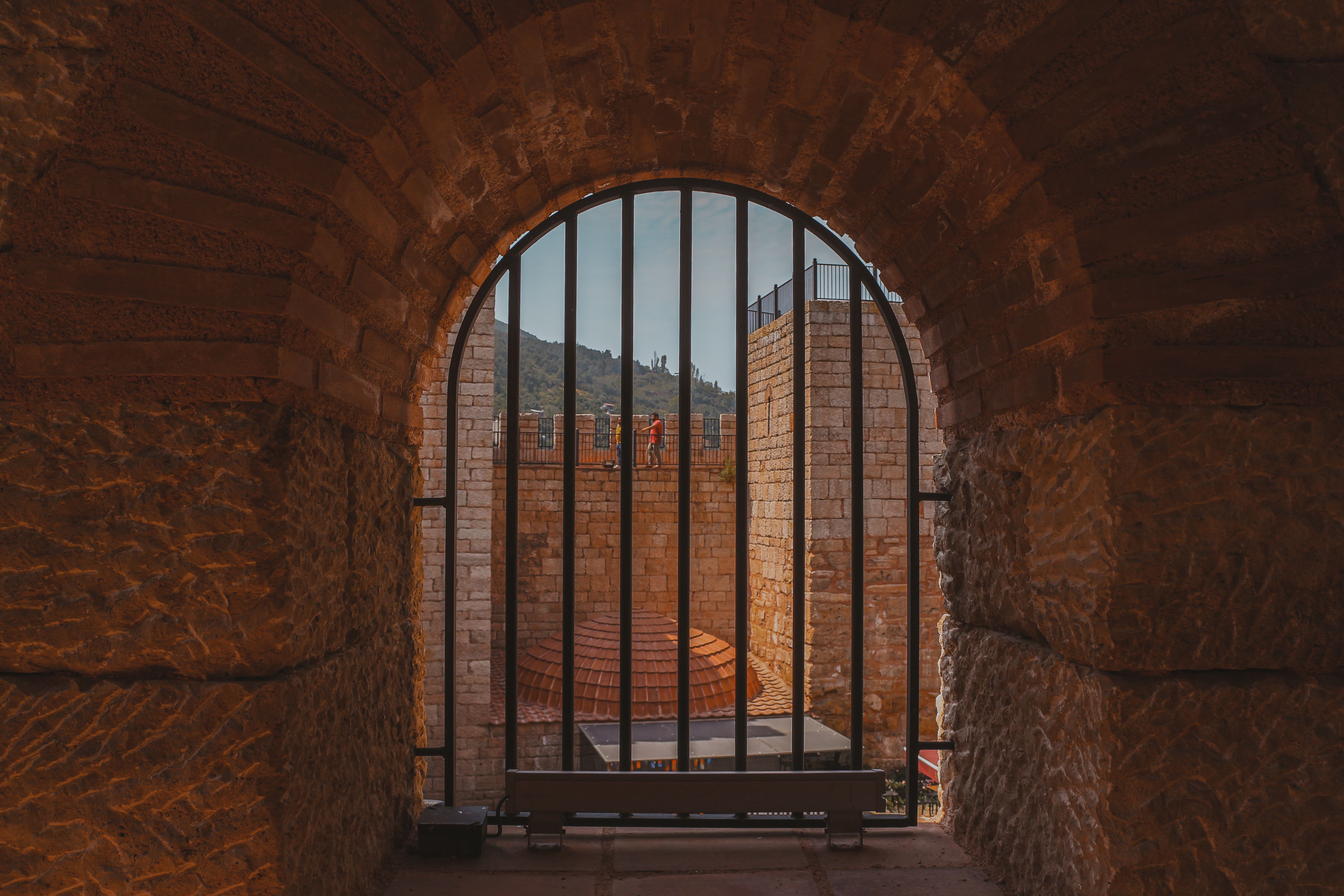 View of a Castle from a Barred Window · Free Stock Photo
