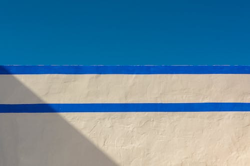 Sky over Wall with Blue Stripes