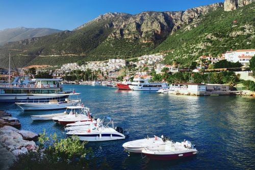 Free Beautiful marina with moored yachts and a coastal town in Kaş, Antalya, Turkey on a sunny summer day. Stock Photo
