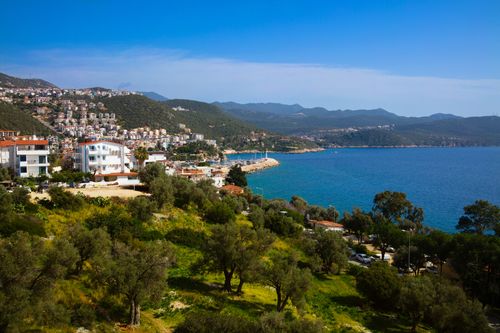 Free Scenic view of Kaş, Antalya, Turkey with lush greenery and the blue sea. Stock Photo