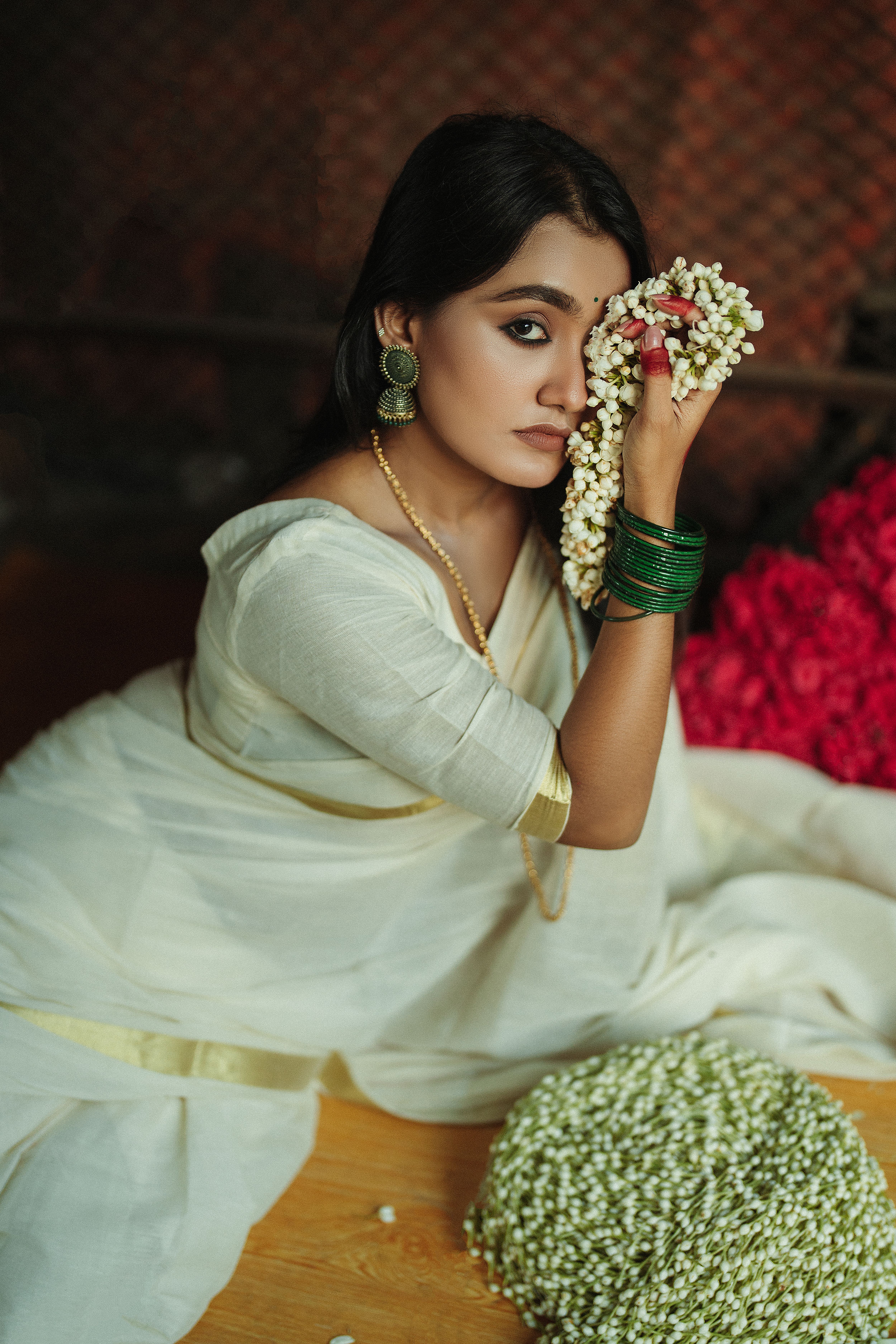 white dress with green jewellery Liz Rattan Ball Green Earrings