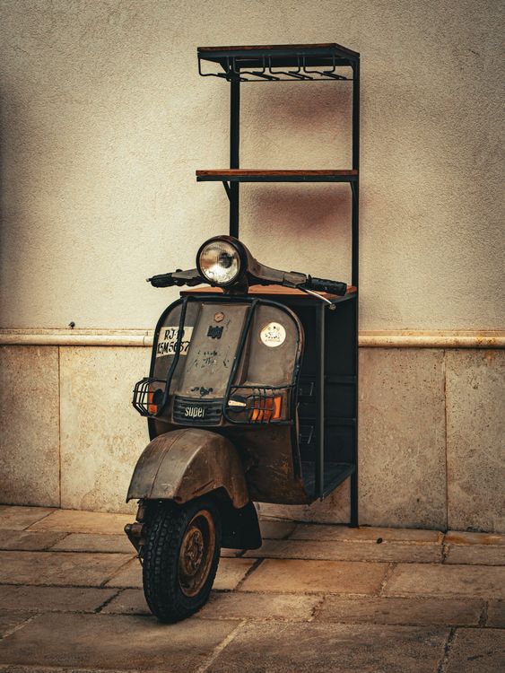 Book Rack Moped A bookshelf Made of Scooter Part · Free Stock Photo