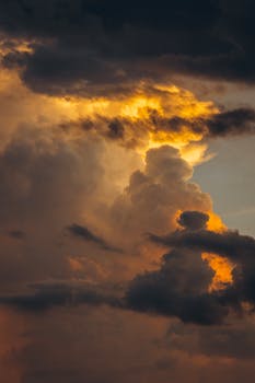 Captivating image of fiery clouds at sunset, showcasing a dramatic and moody sky.