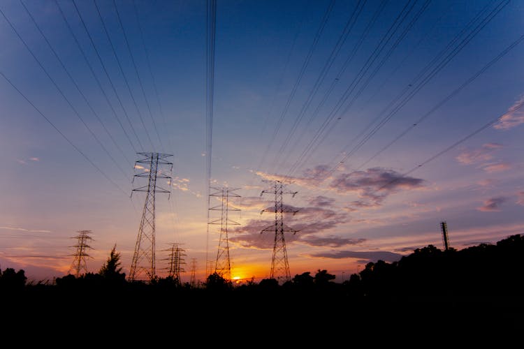 Electricity Pylons At Dawn