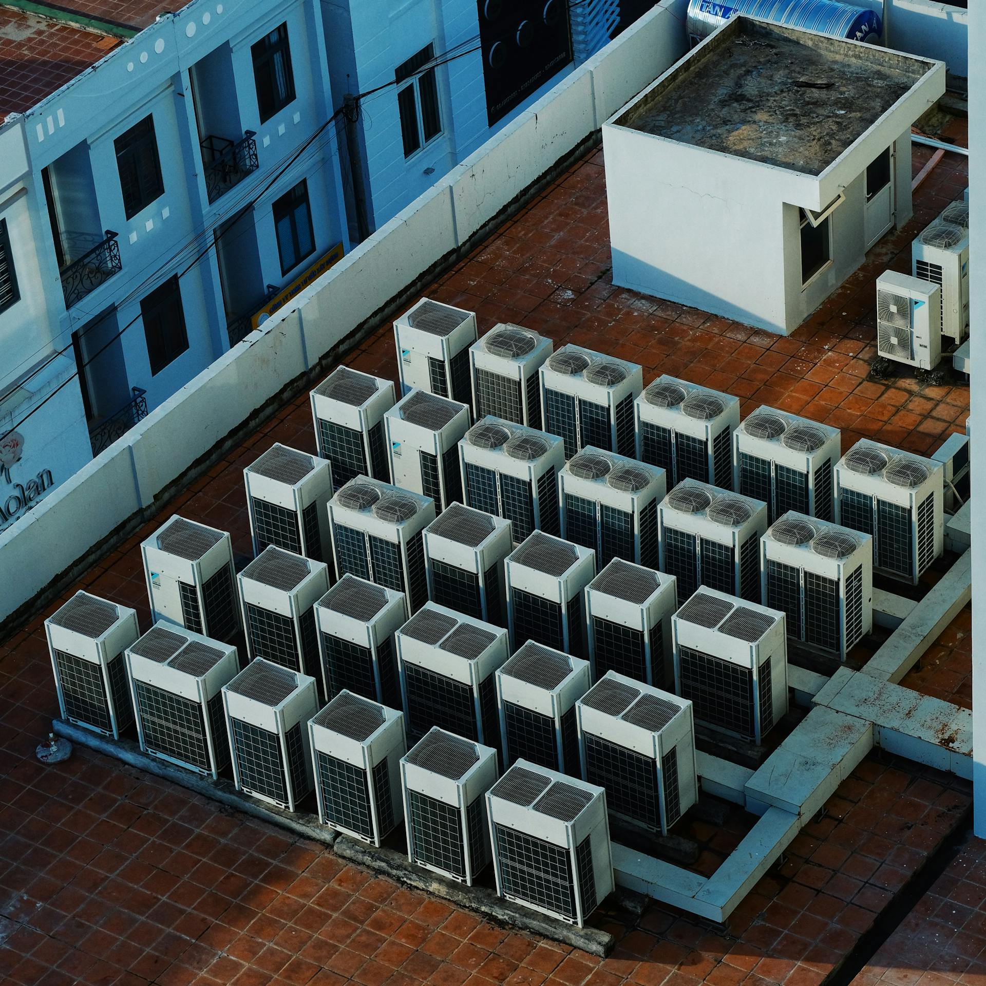 High angle view of rooftop HVAC units on a building in Buon Ma Thuot, Vietnam.