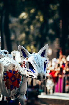 Close-up of a vibrant alebrije sculpture at a Day of the Dead parade in Mexico City.