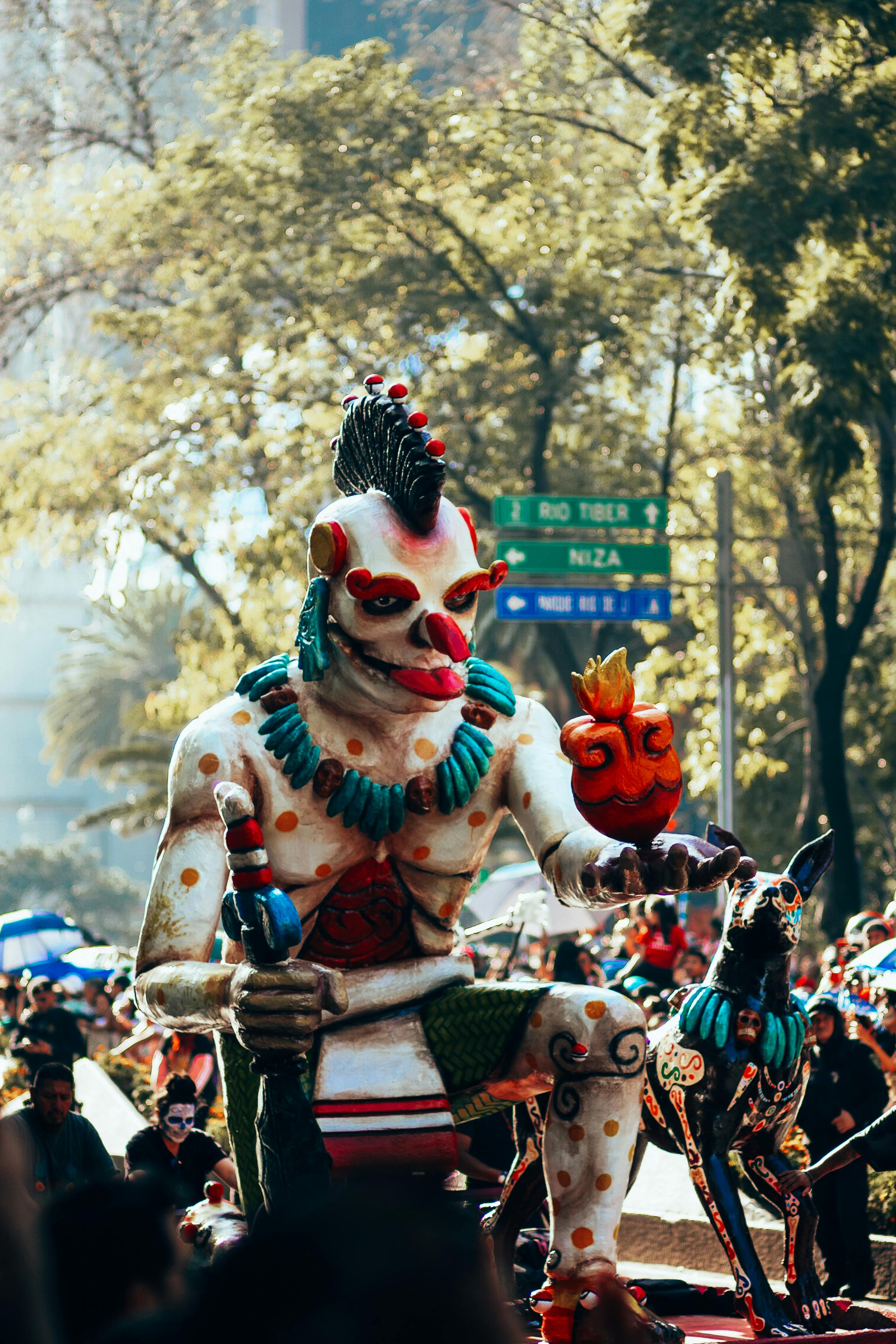 Vibrant statue at the Day of the Dead parade in Mexico City captures cultural celebration.